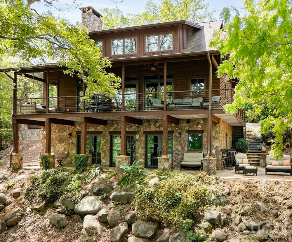 Two-story rustic cabin with stone foundation